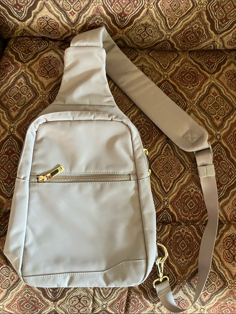 Tumi Beige Crossbody Sling Bag with Gold Hardware